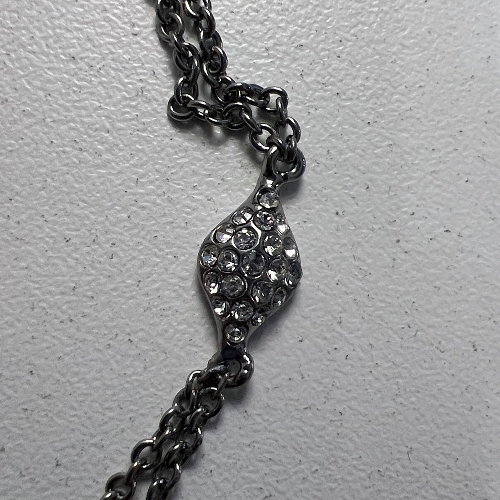 JTV JOAN BOYCE, GUNMETAL TONE
WITH WHITE CRYSTAL EVIL EYE
STATION BRACELET - Picture 5 of 7